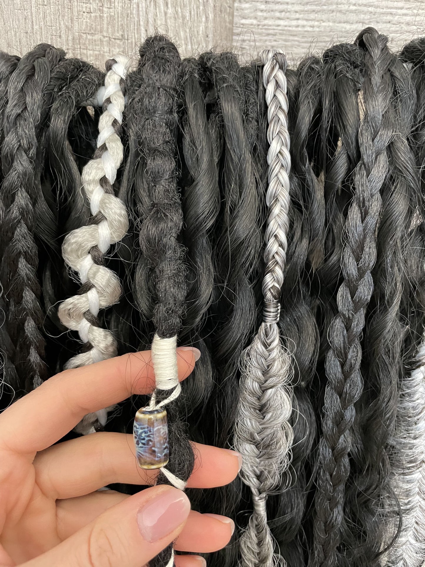 black bohemian synthetic dreadlocks and dark gray textured braids